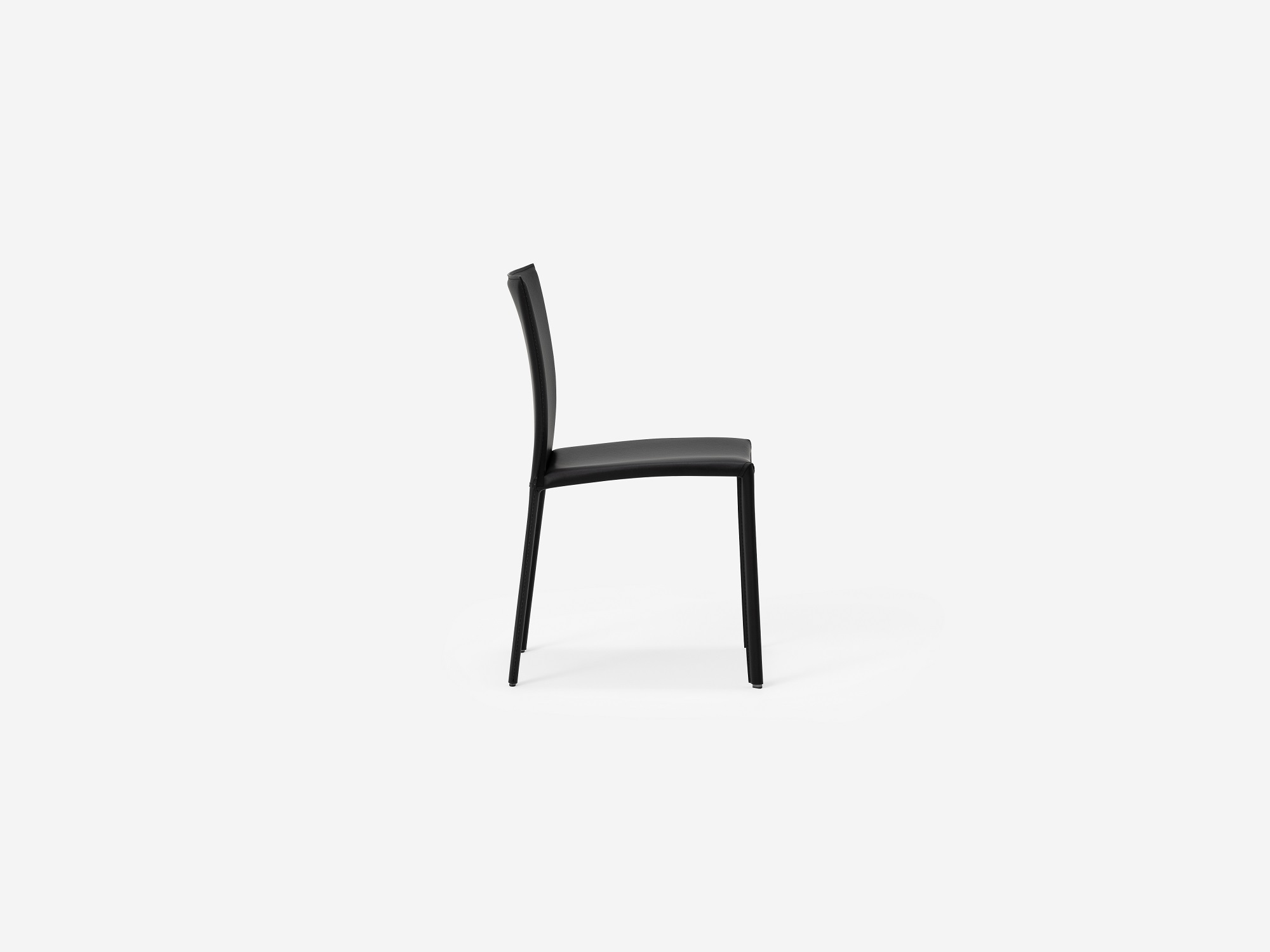 Side view of the Acel Mid Century Dining Chair in black leather