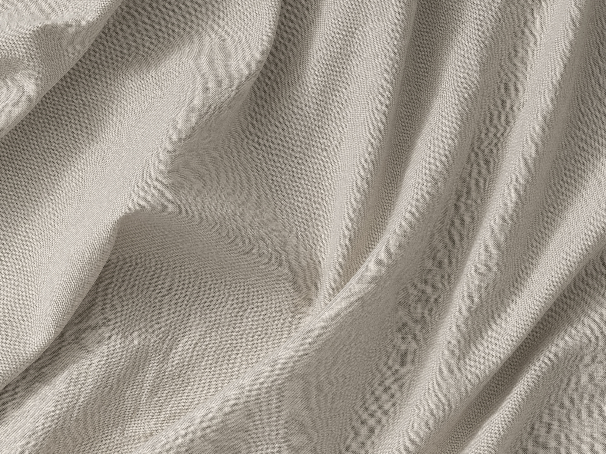 Detail view of linen cotton sheets in cream