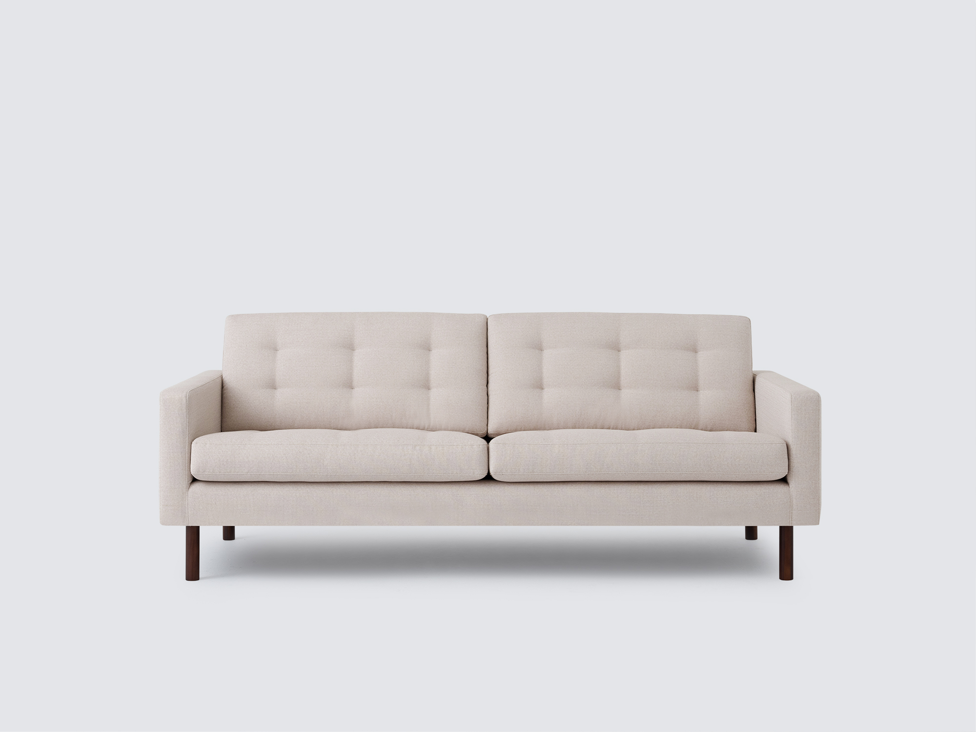 Front view of the Joan modern sofa upholstered in beige fabric