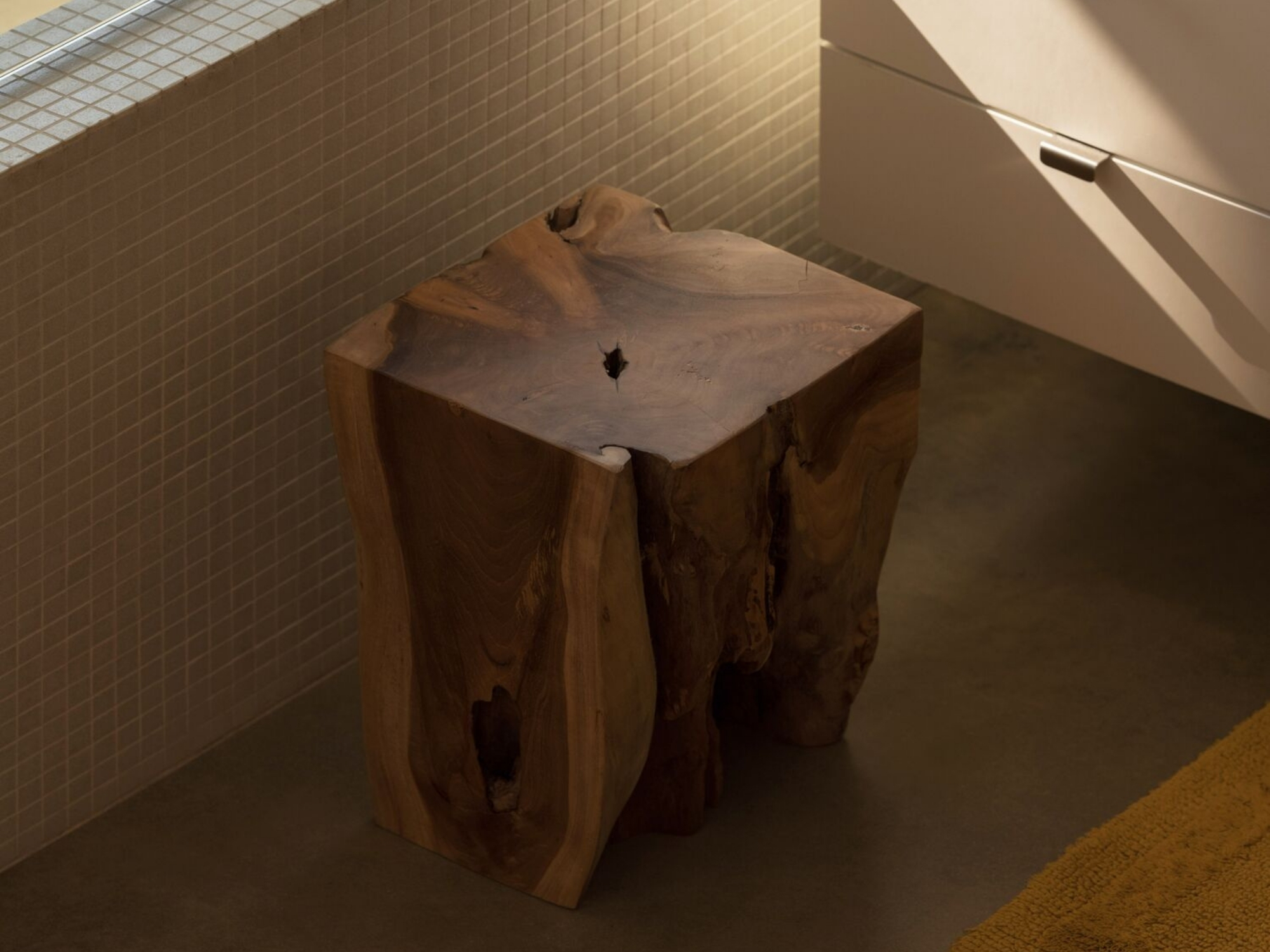 Solid teak wood stool in modern bathroom