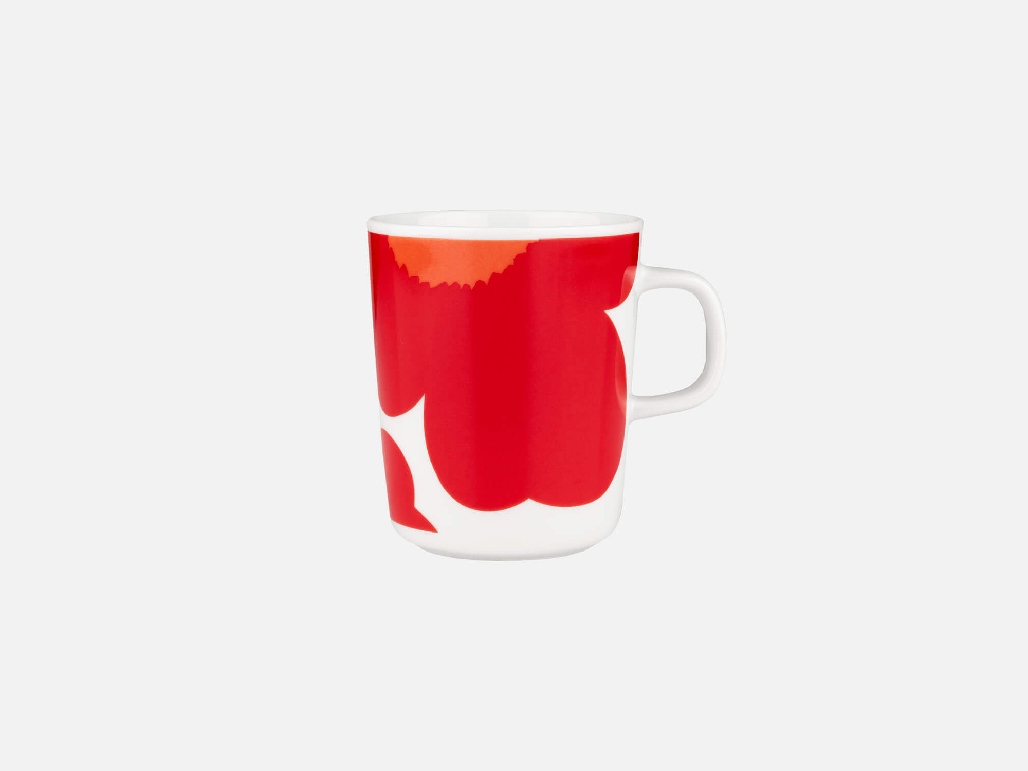 Front view of Marimekko coffee mug with giant red poppy pattern