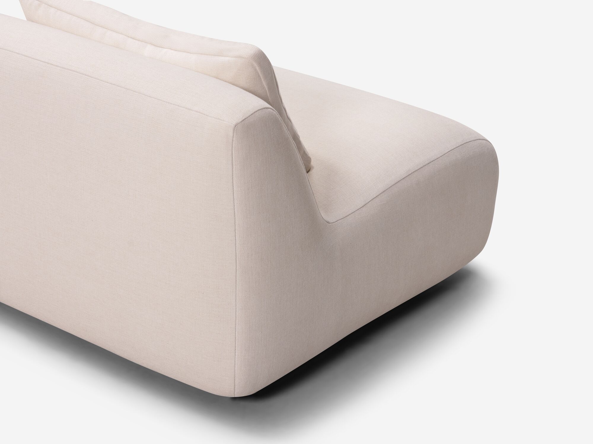 Beige curved sectional back detail view