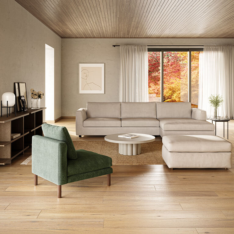 White fabric sectional sofa is shown in a living room setting. Link to ready to ship page