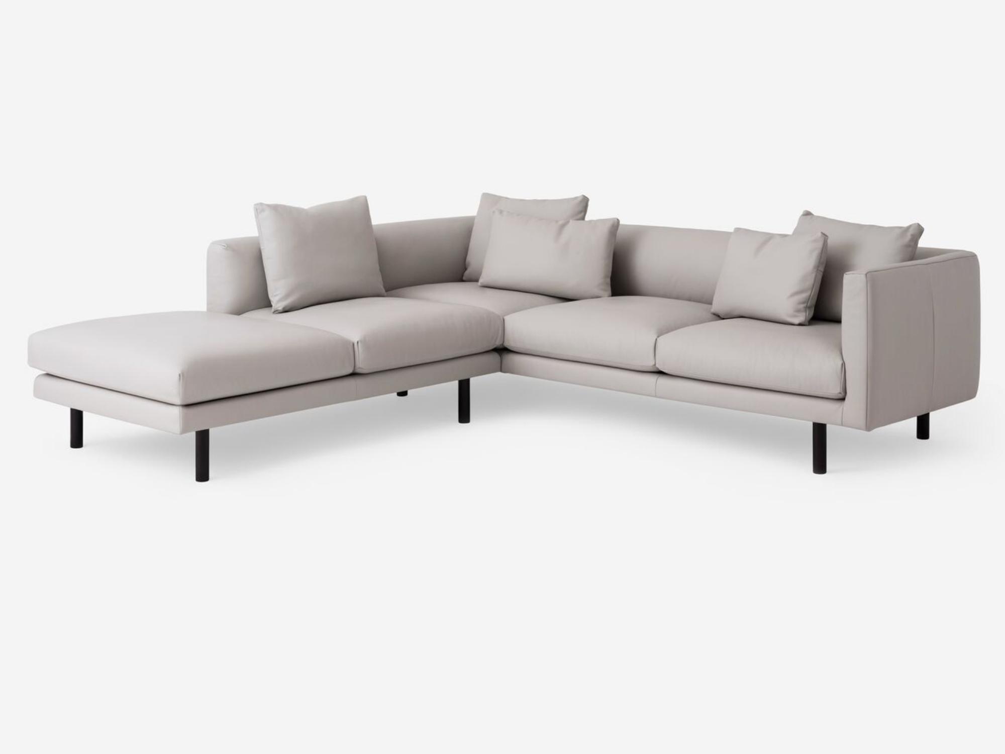 Angled view of the Replay modern sectional upholstered in white leather