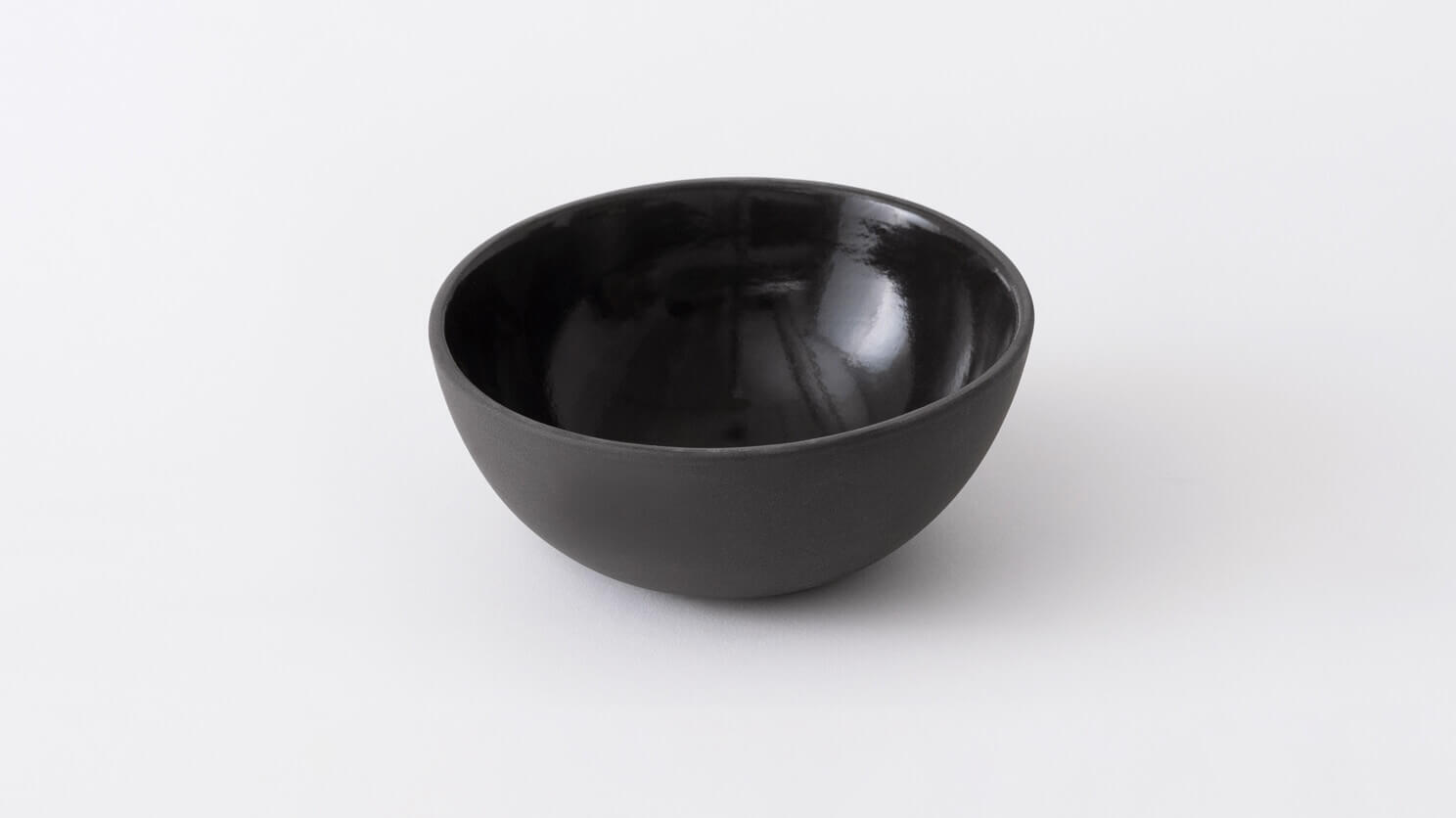 Top view of small black stoneware bowl