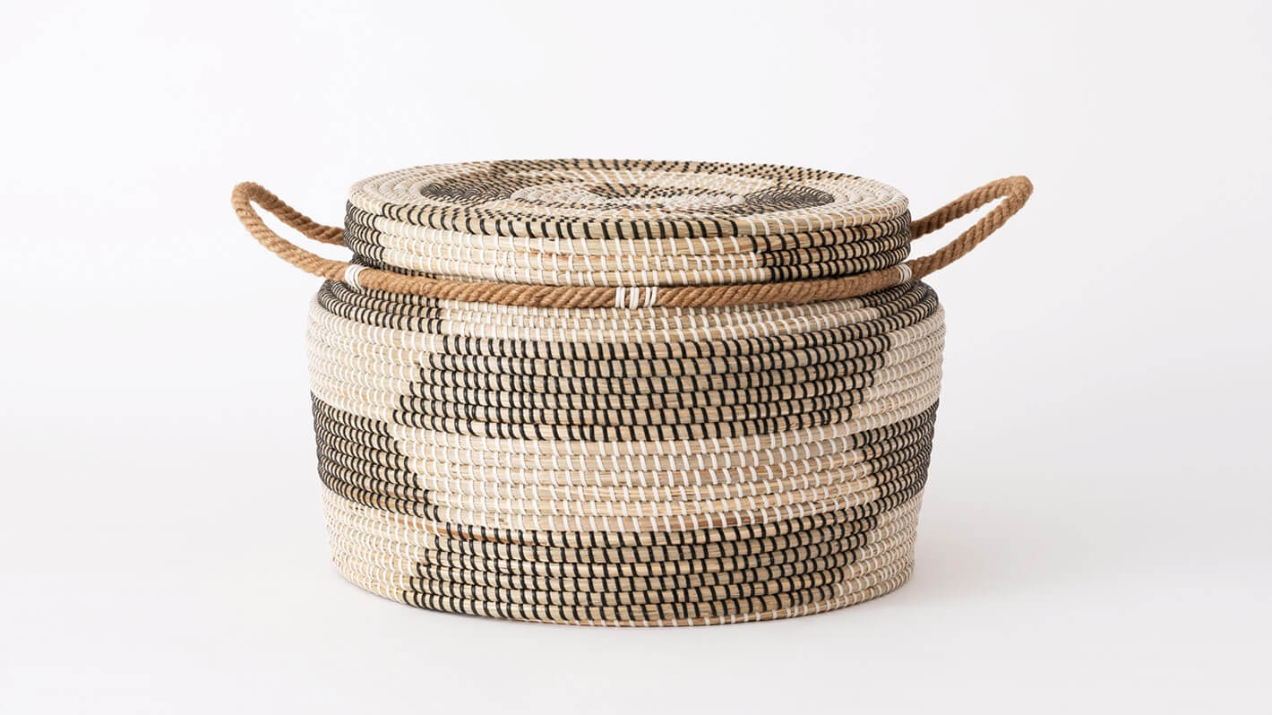 Side view of large handwoven black and beige basket