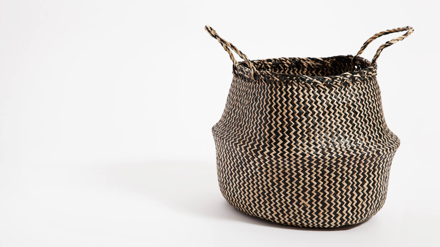 Detail view of the small black woven Trundle basket