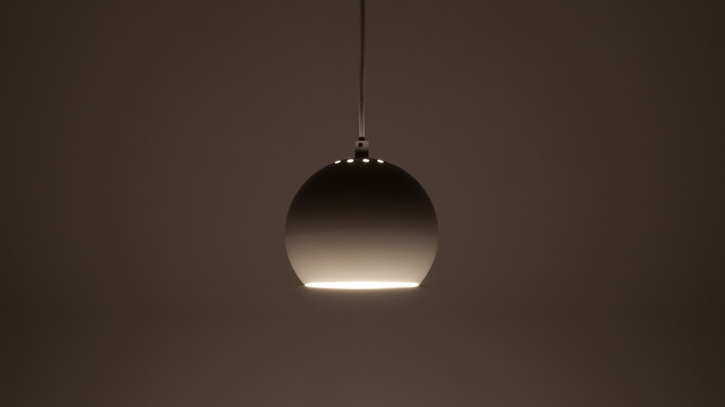 The Ball contemporary pendant lamp in white with light on