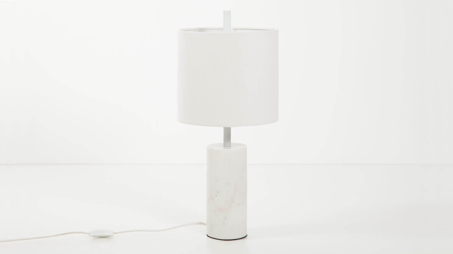 The Drum table lamp canada with white marble base in a white room