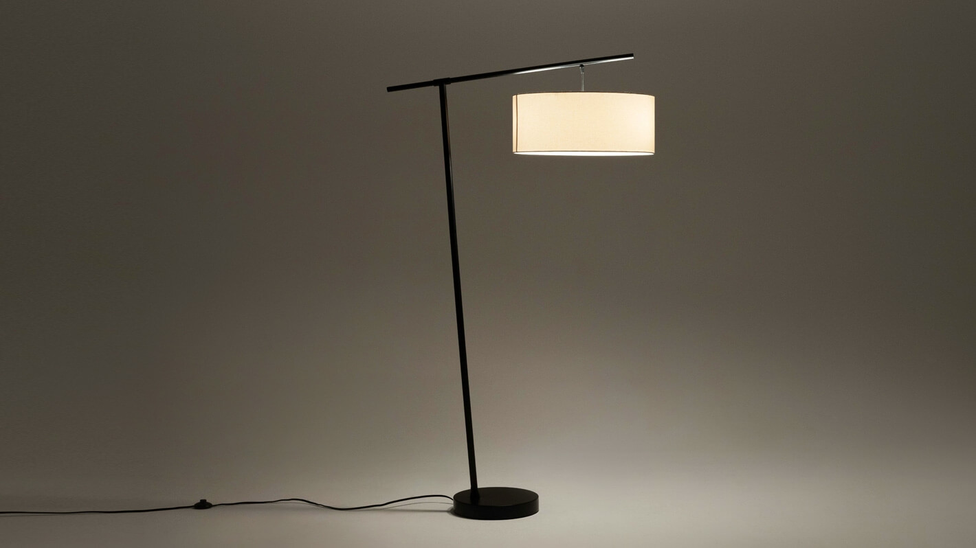 Front view of the Conick cool floor lamp in black with light on