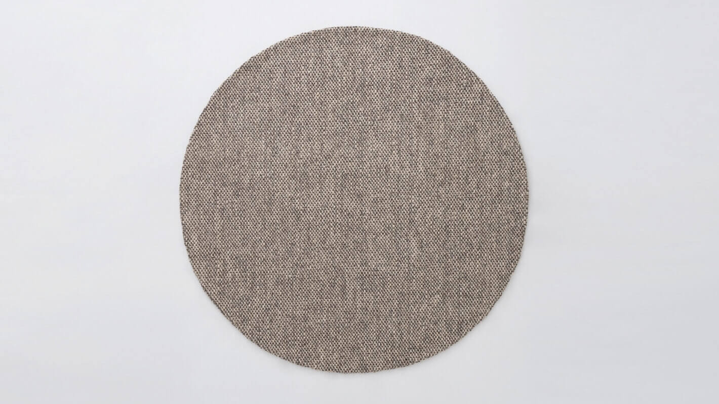 Overhead view of the Bila round rug in light grey