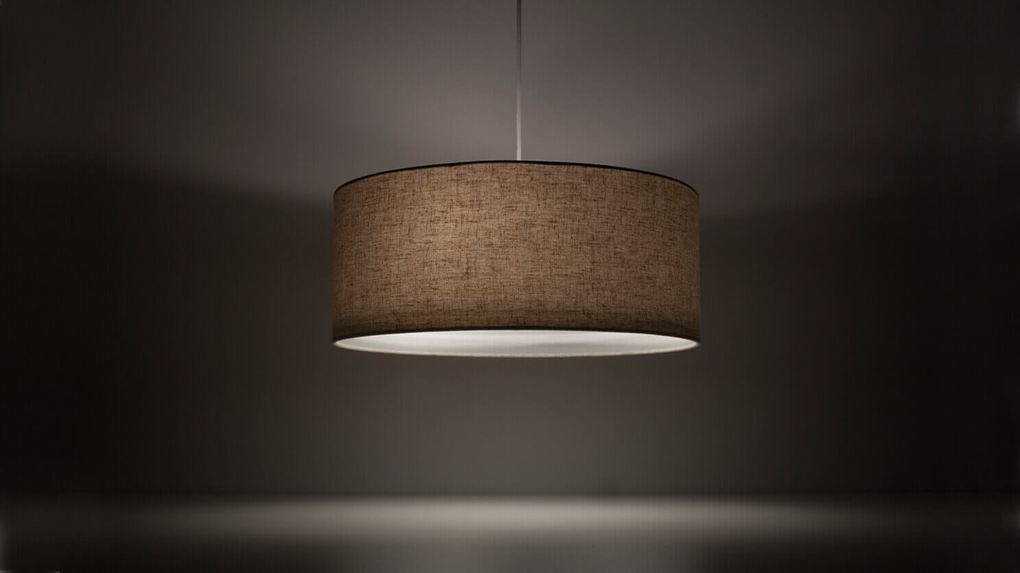 Front view of the Conick modern linen pendant lighting in a gray room