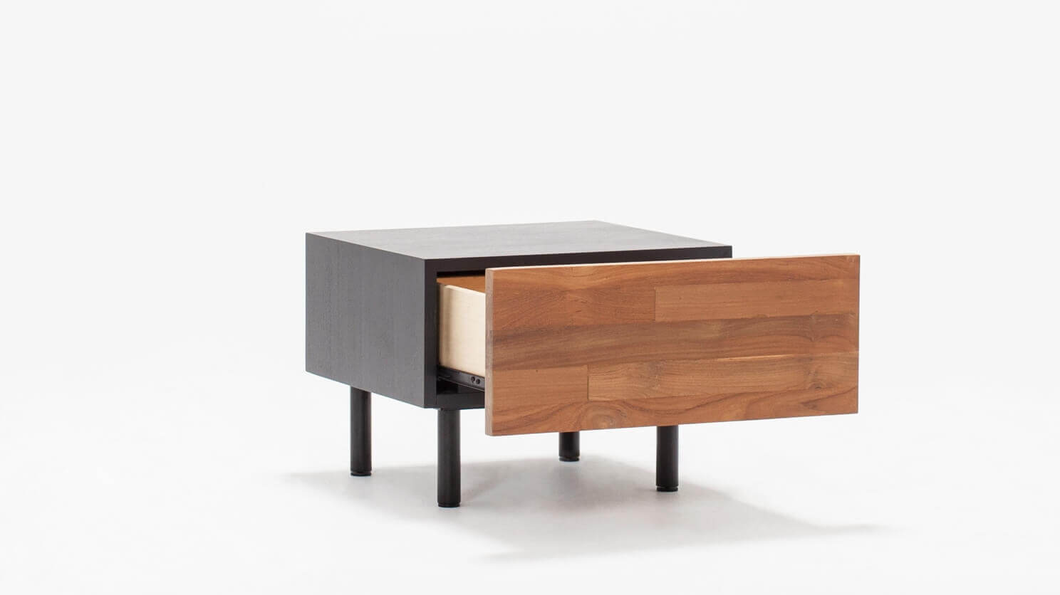 Angled view of the Reclaimed modern teak nightstand with black case with open drawer