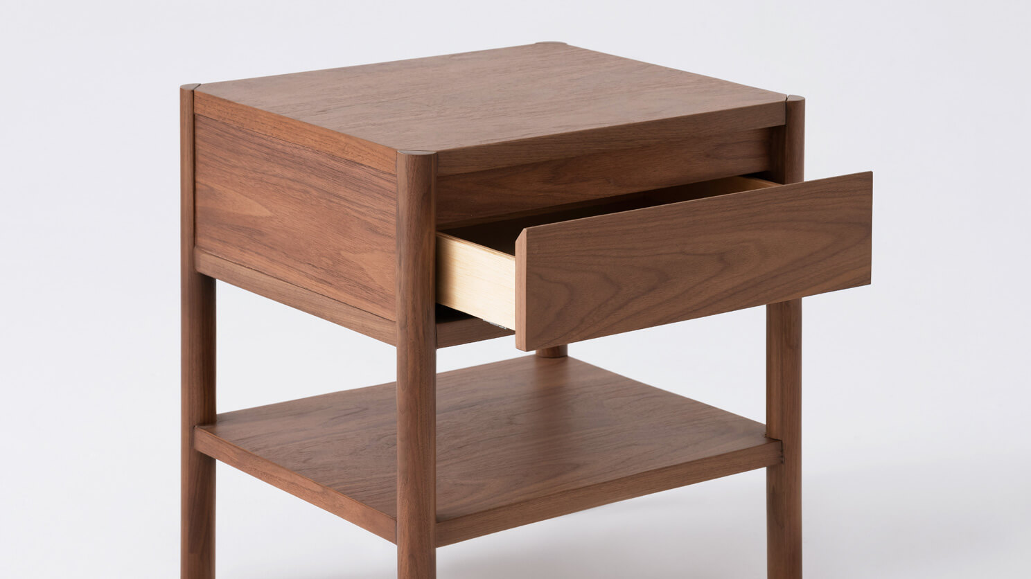 Detail view of the Monarch single drawer low nightstand in walnut with drawer open