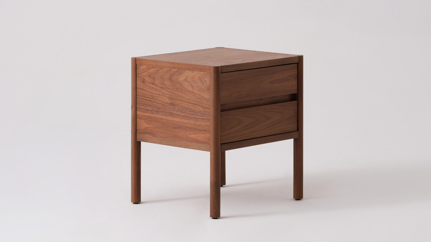 Double drawer nightstand in walnut front angle view