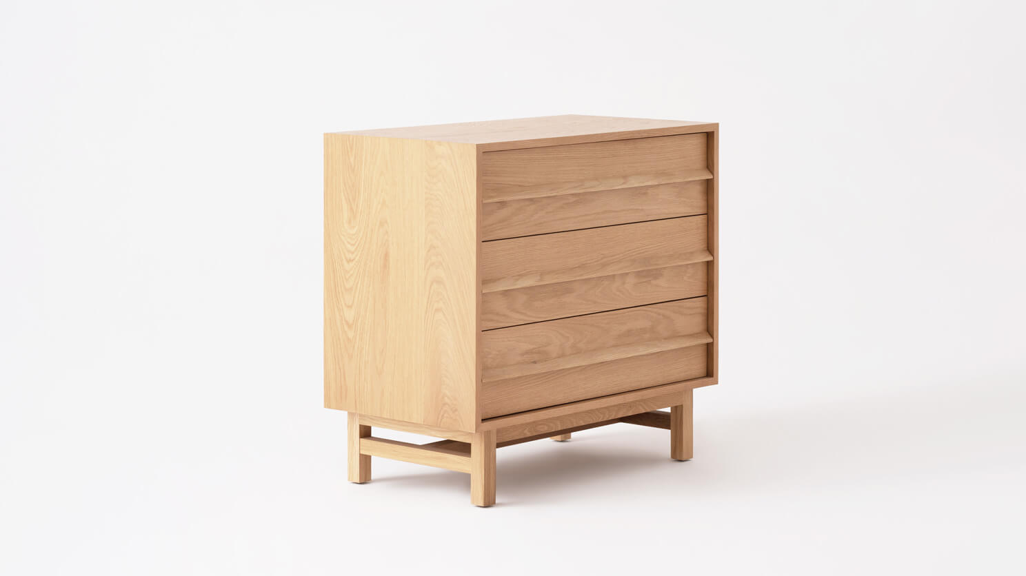 Angled view of the Marcel mid century dresser in oak