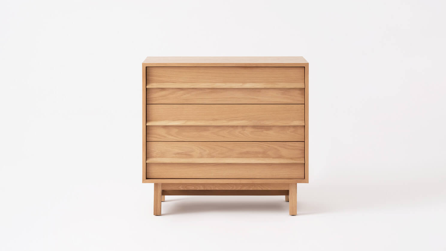 Front view of the Marcel mid century dresser in oak