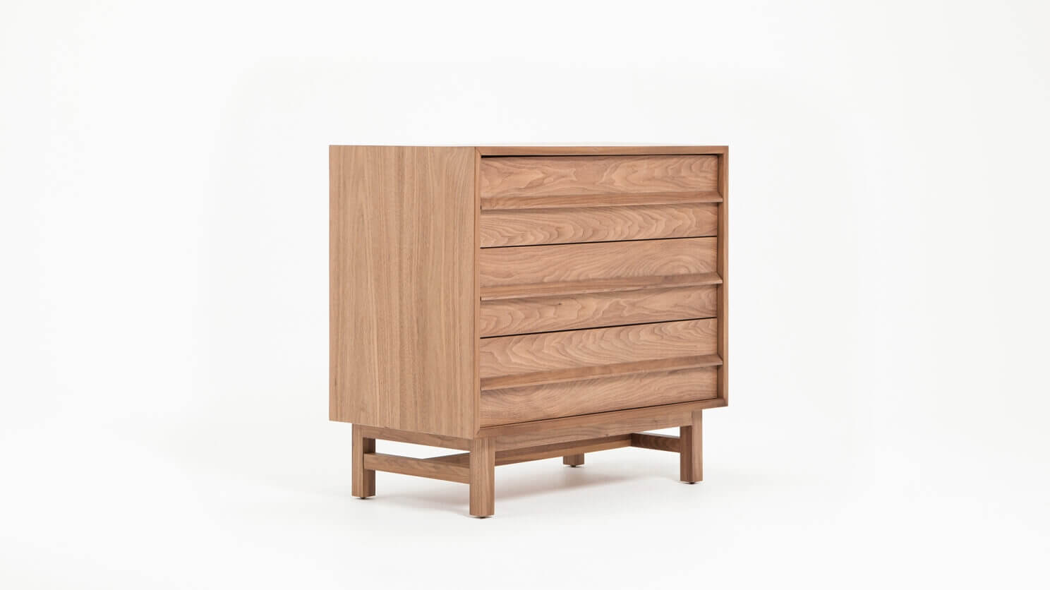 Angled view of the Marcel mid century dresser in walnut