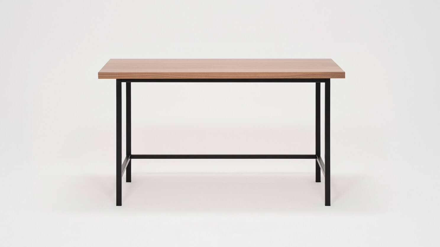 Front view of the Kendall custom desk with walnut veneer top and black base