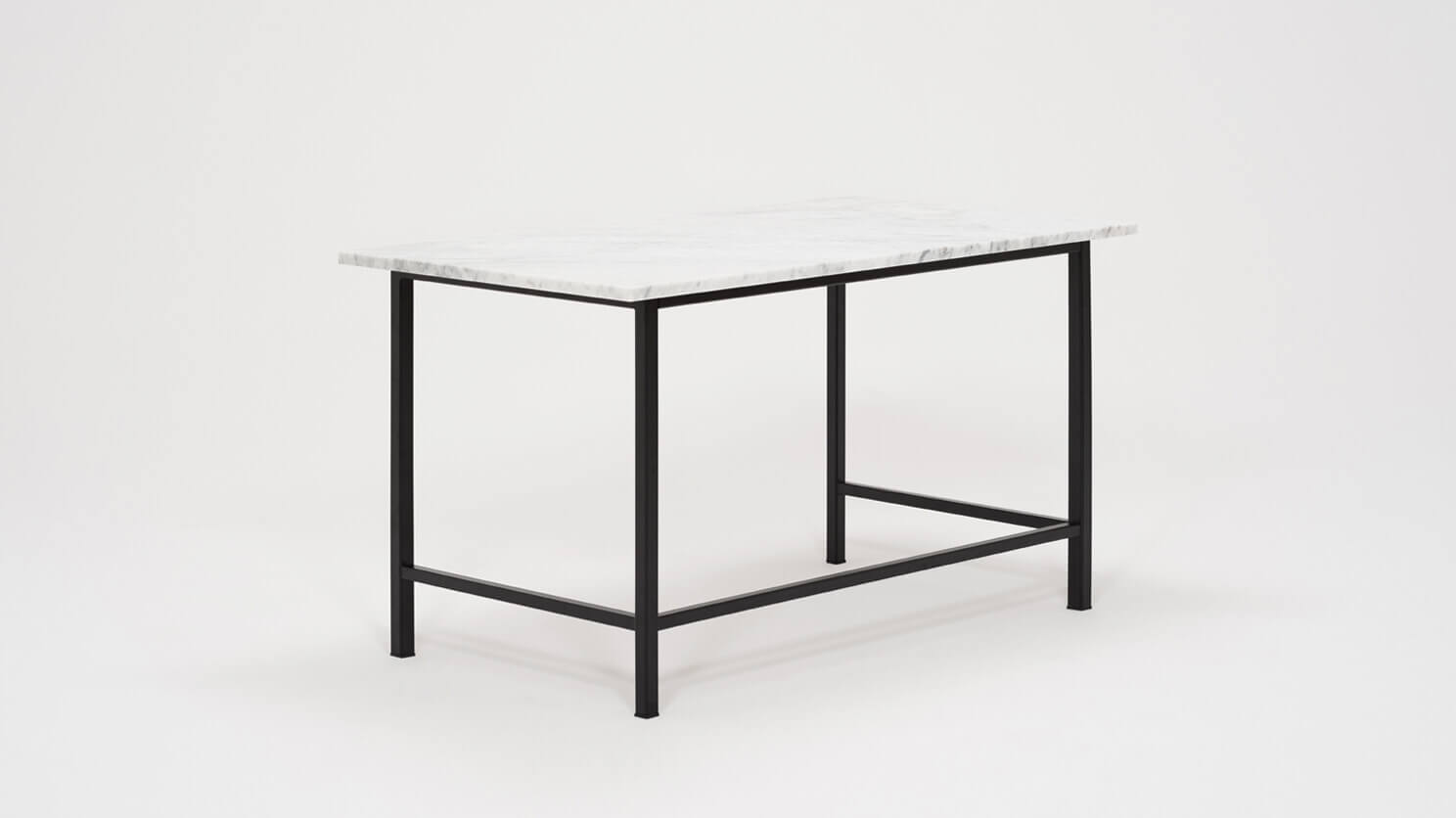 Angled view of the Kendall studio desk with marble top and black base