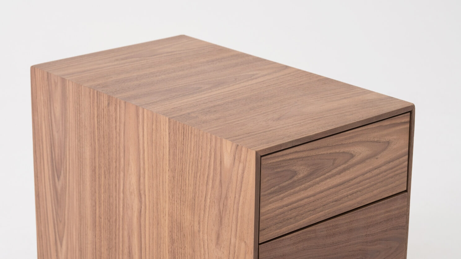 Top detail view of walnut filing cabinet