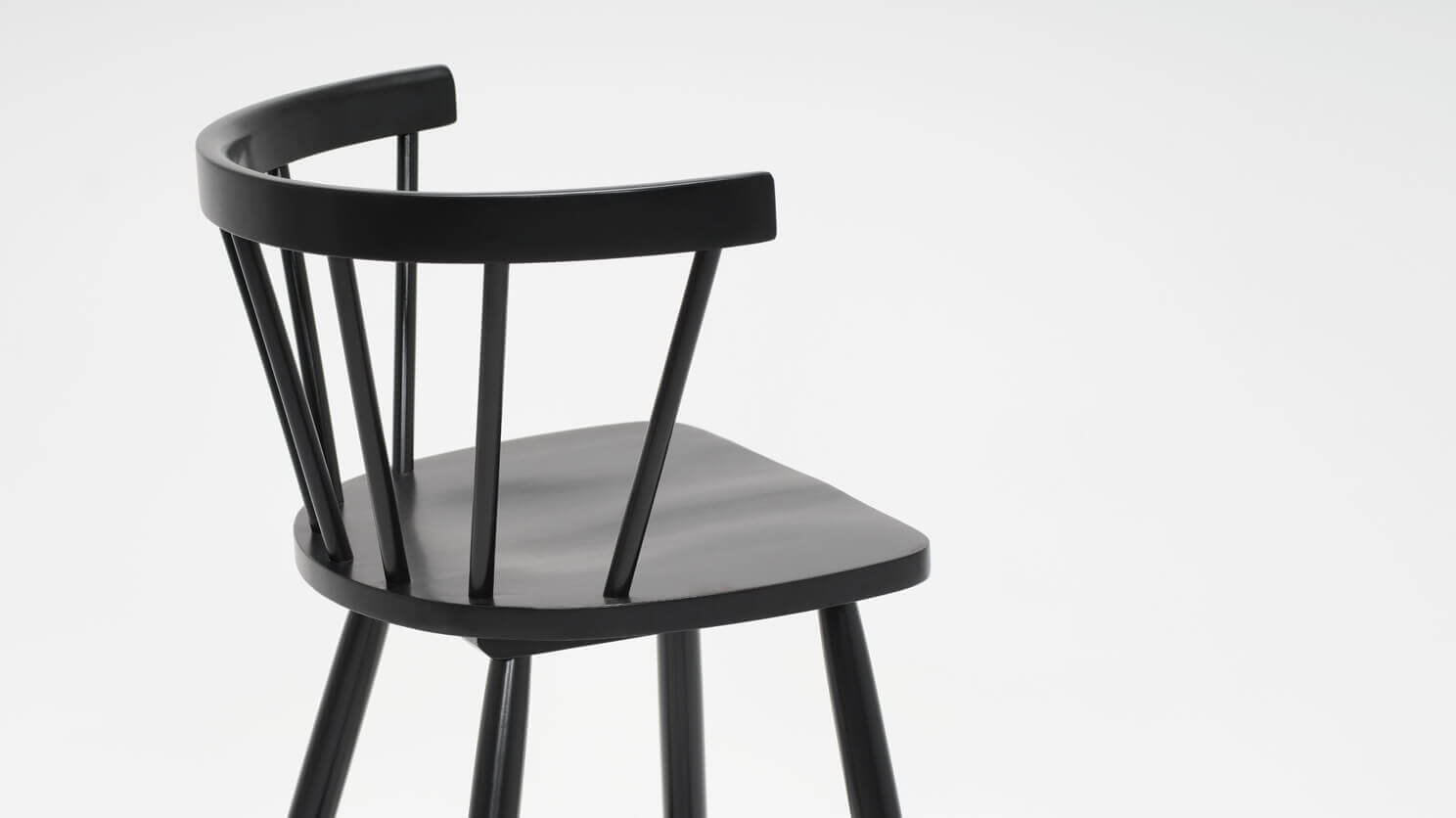 Detail view of the Lyla modern arm counter stool in black