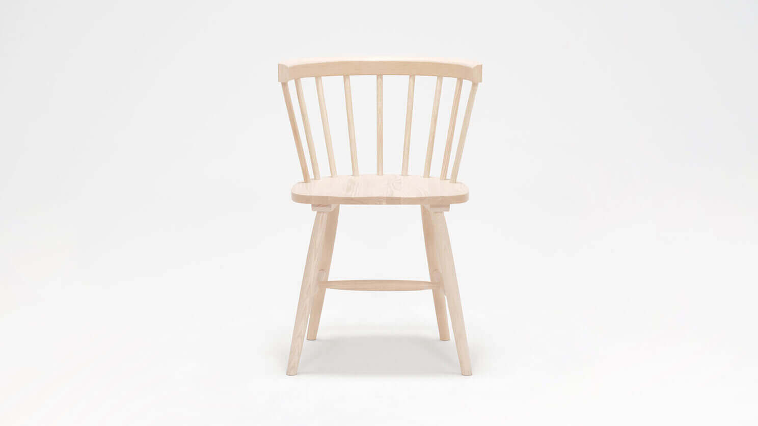 Front view of the Lyla mid century dining chair in solid ash