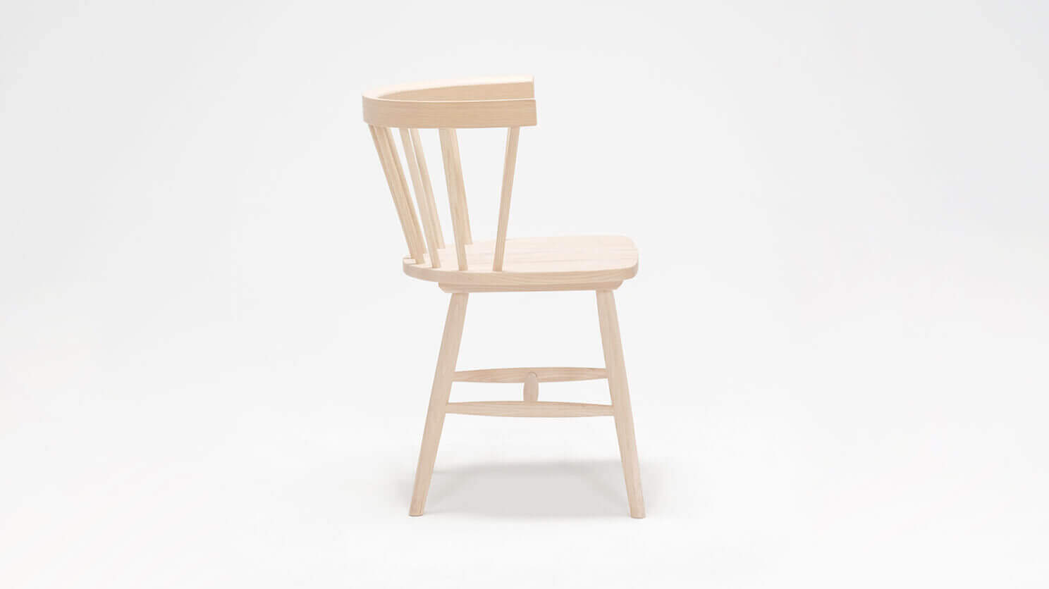 Side view of the Lyla mid century dining chair in solid ash