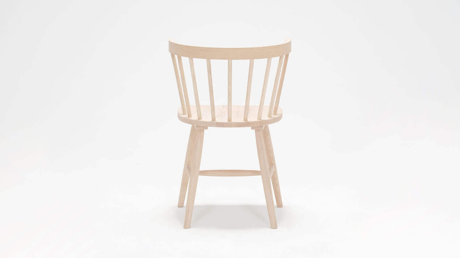 Back view of the Lyla mid century dining chair in solid ash