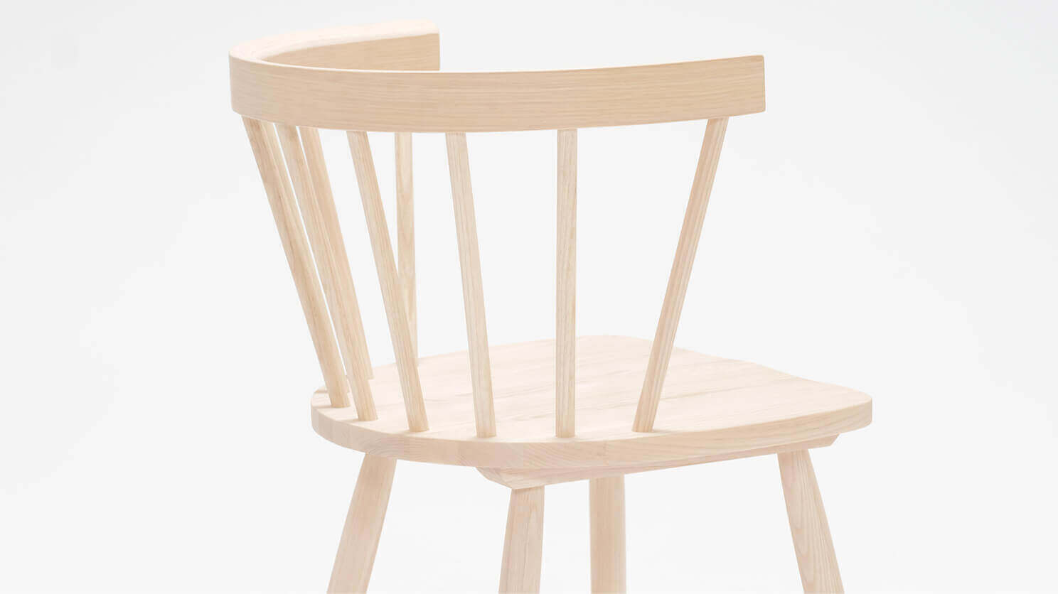 Detail view of the Lyla mid century dining chair in solid ash