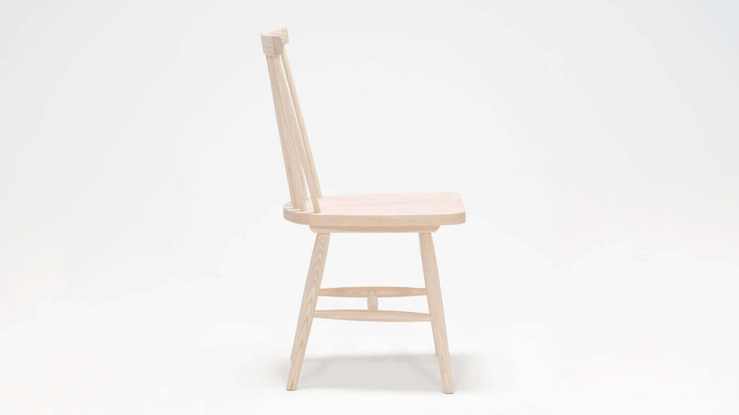 Side view of the Lyla modern side dining room chair in solid ash