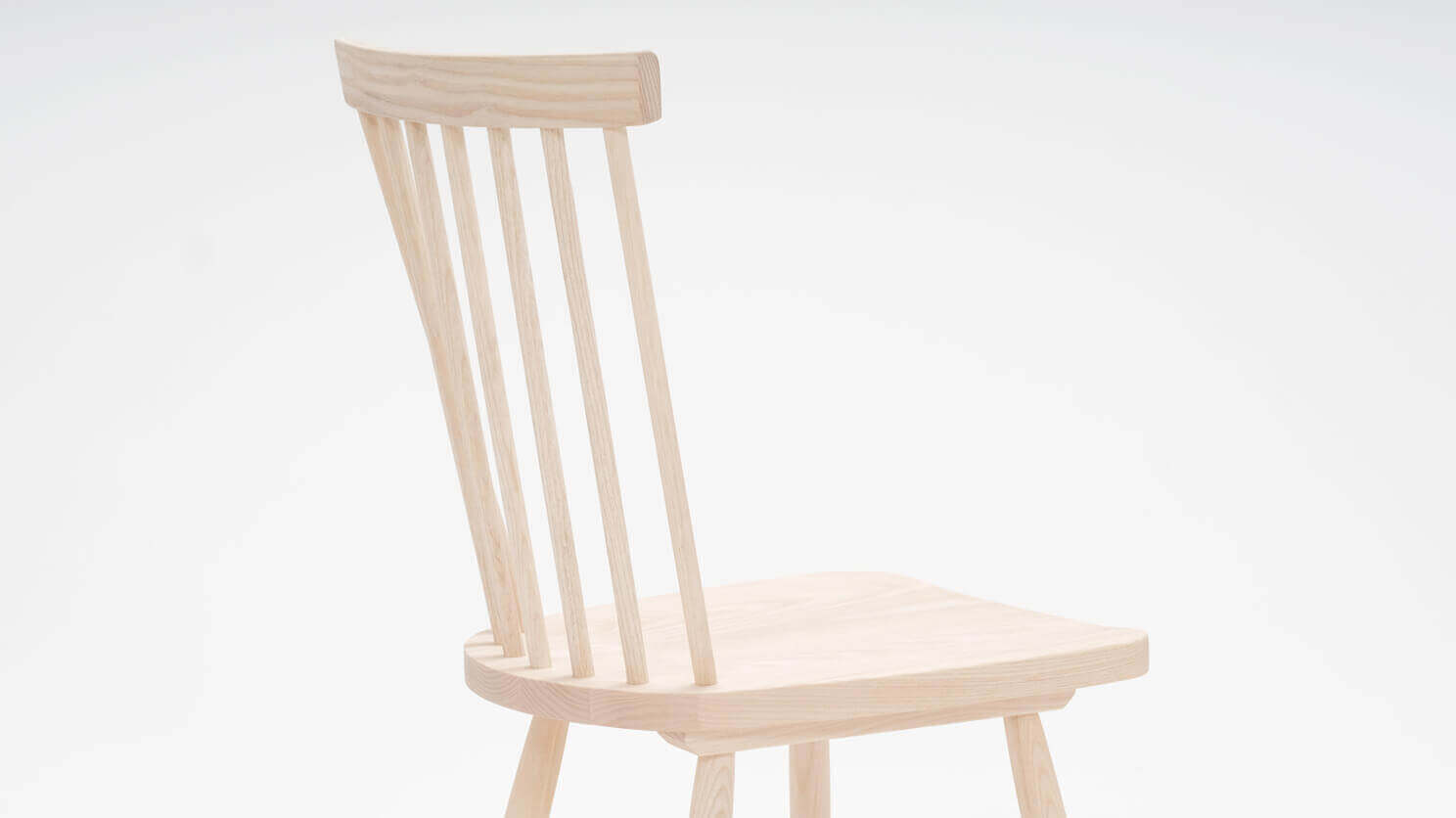 Detail view of the Lyla modern side dining room chair in solid ash