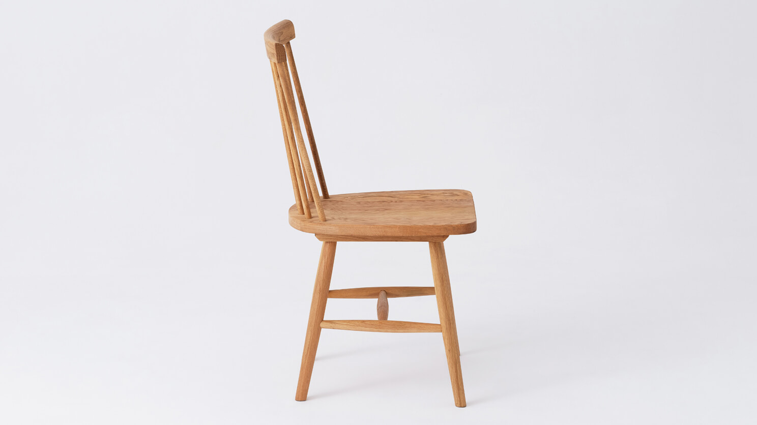 Side view of the Lyla modern side dining room chair in solid oak