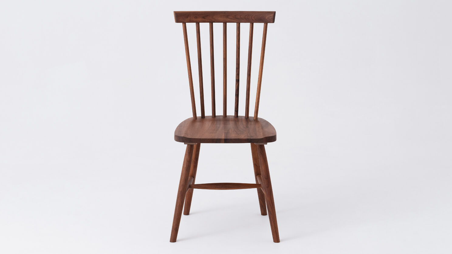 Front view of the Lyla modern side dining room chair in solid walnut