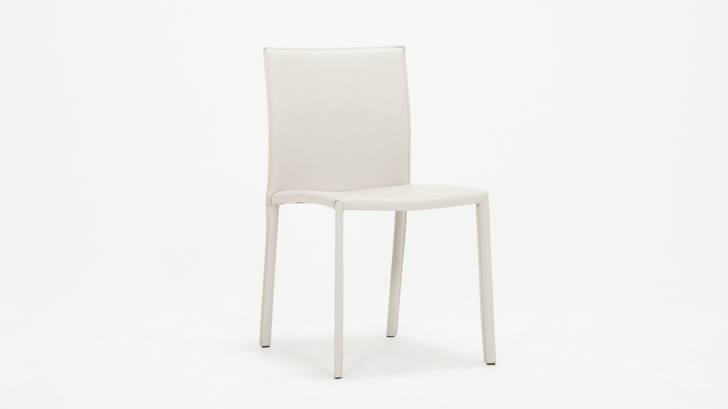 Angled view of the Acel Dining Chair in light grey leather