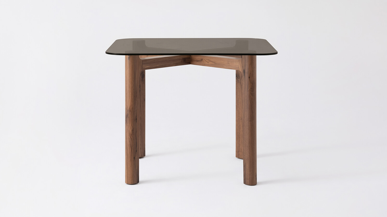 Front view of the Place square contemporary dinette table with brown glass top and walnut legs