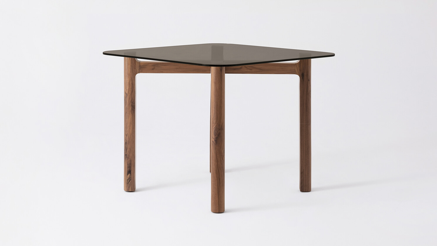 Side view of the Place square contemporary dinette table with brown glass top and walnut legs