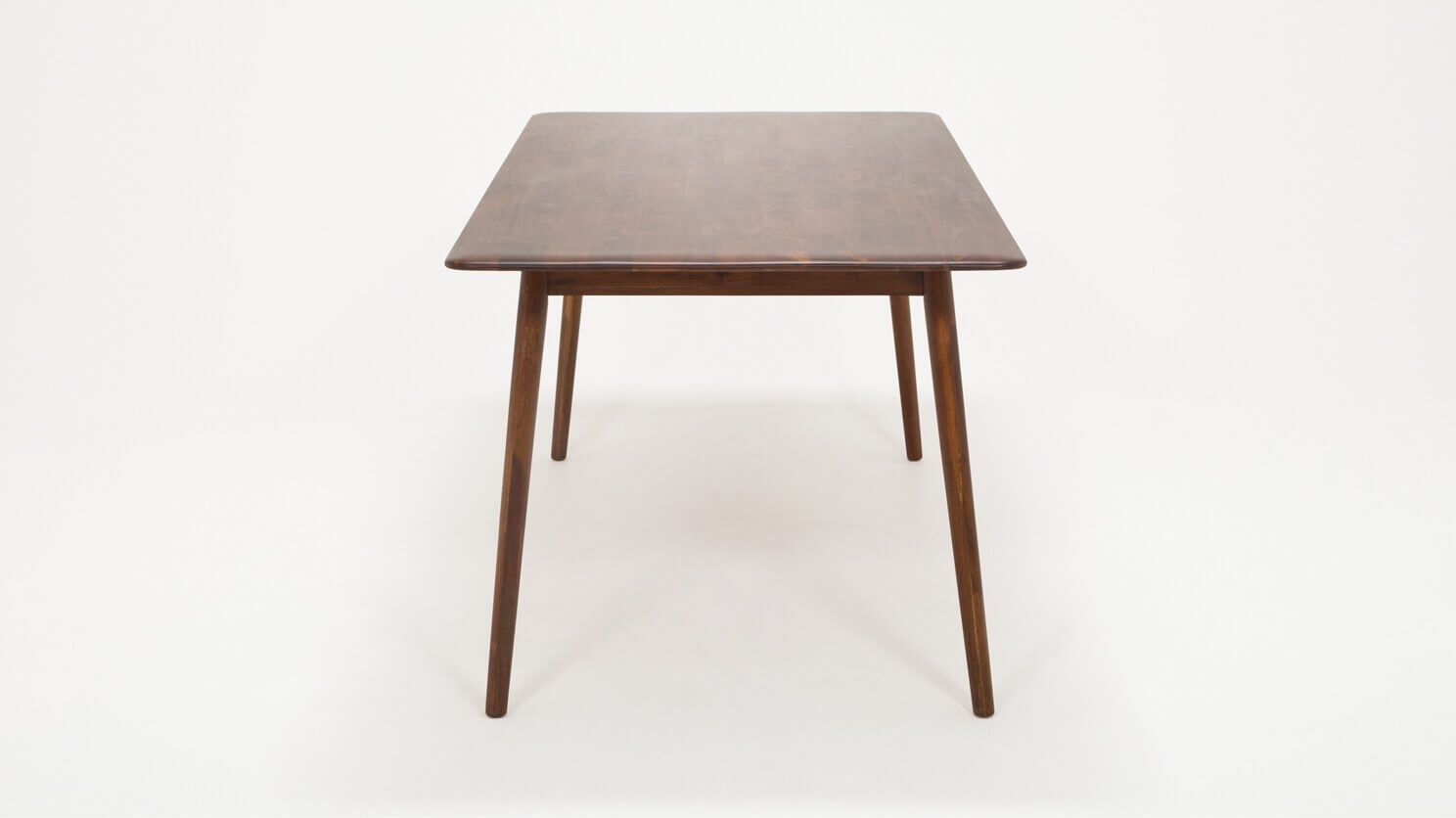 Side view of the medium sized Kacia solid wood dining table in java