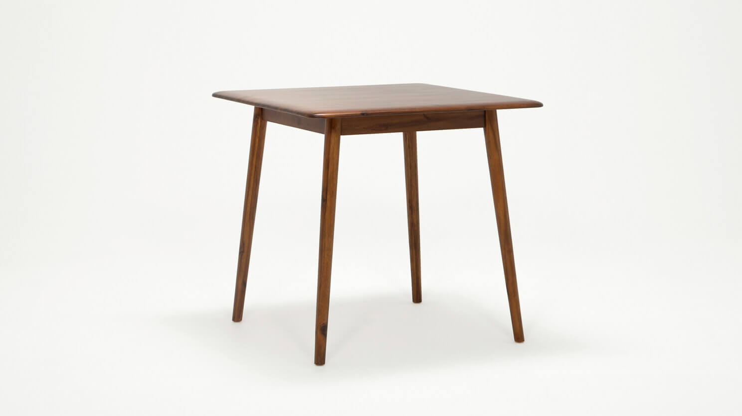 Angled view of the modern Kacia Dinette Table in java