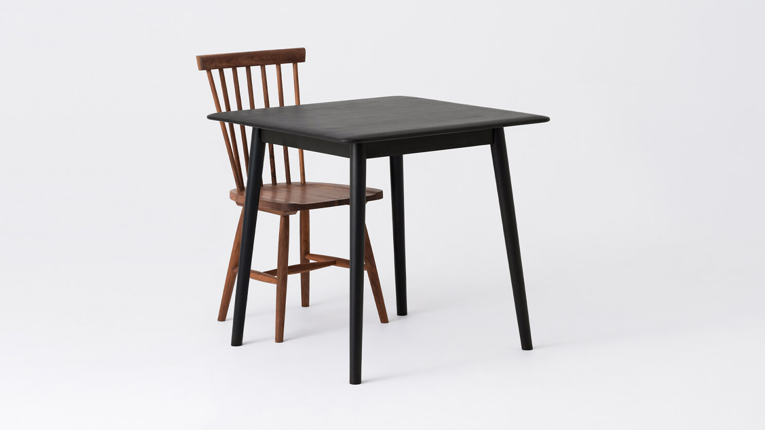 The Kacia Dinette Table in black with a Lyla dining chair