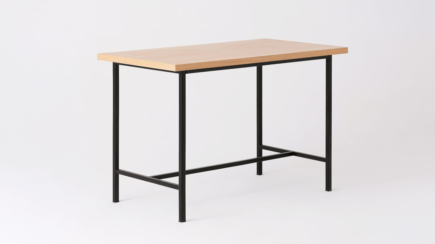 Angled view of the Kendall modern counter table with oak veneer top and black base