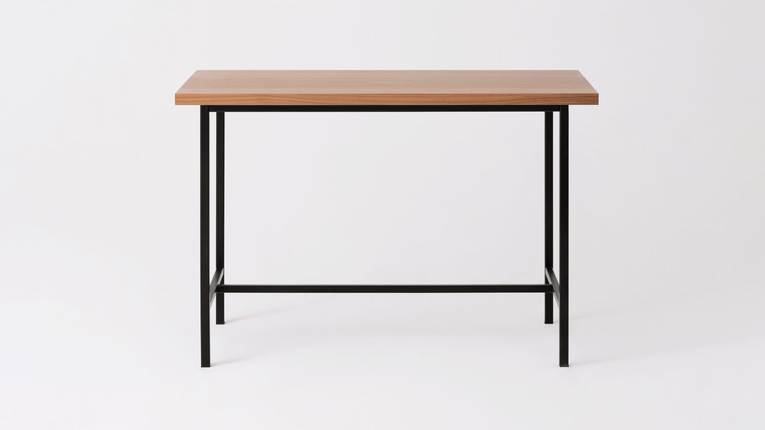 Front view of the Kendall modern counter table with walnut veneer top and black base