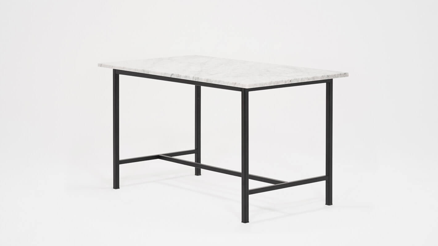 Angled view of the Kendall 54" modern dining table with marble top and black base