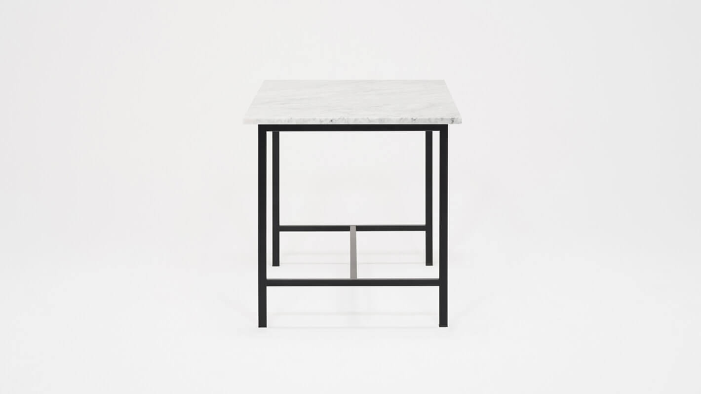 Side view of the Kendall 54" modern dining table with marble top and black base