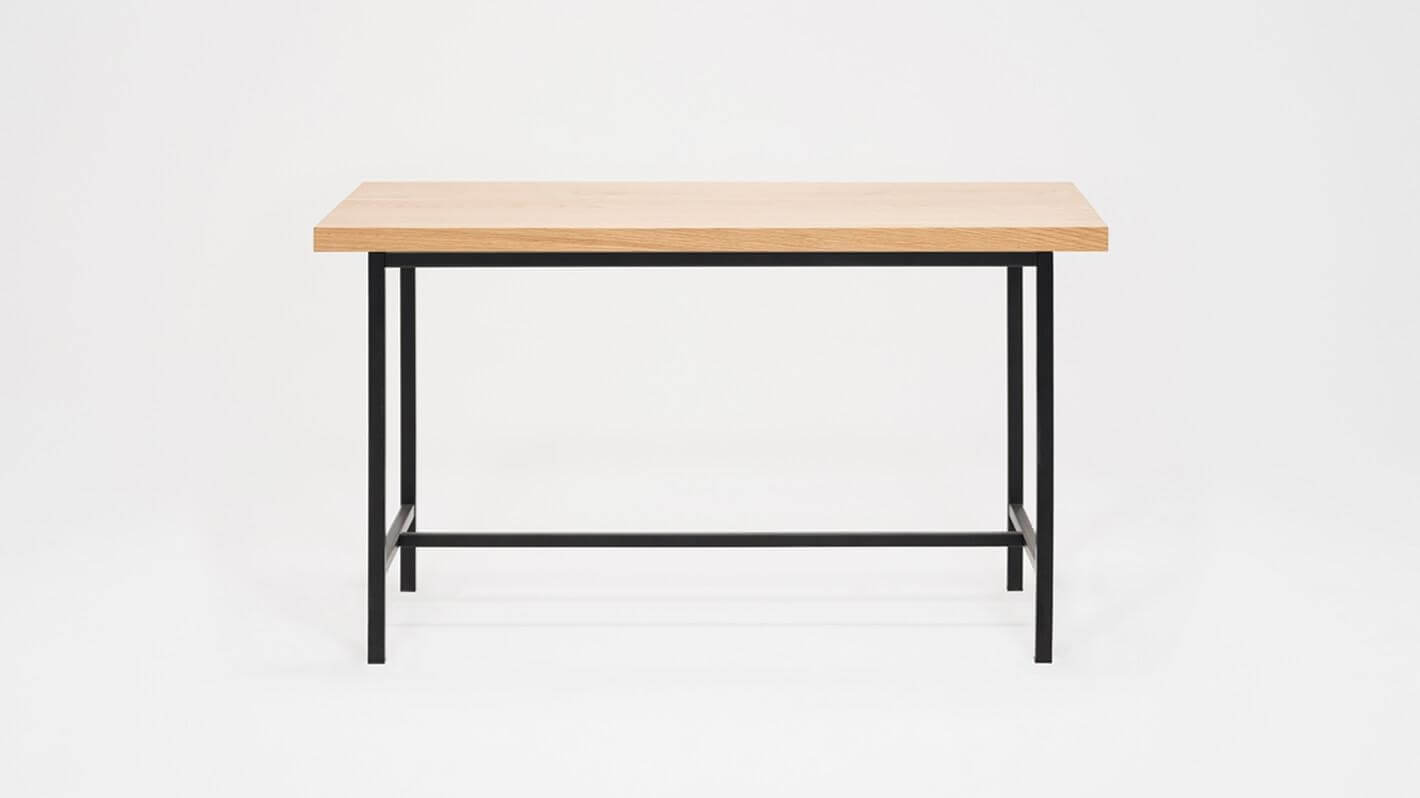 Front view of the Kendall 54" modern dining table with oak veneer top and black base