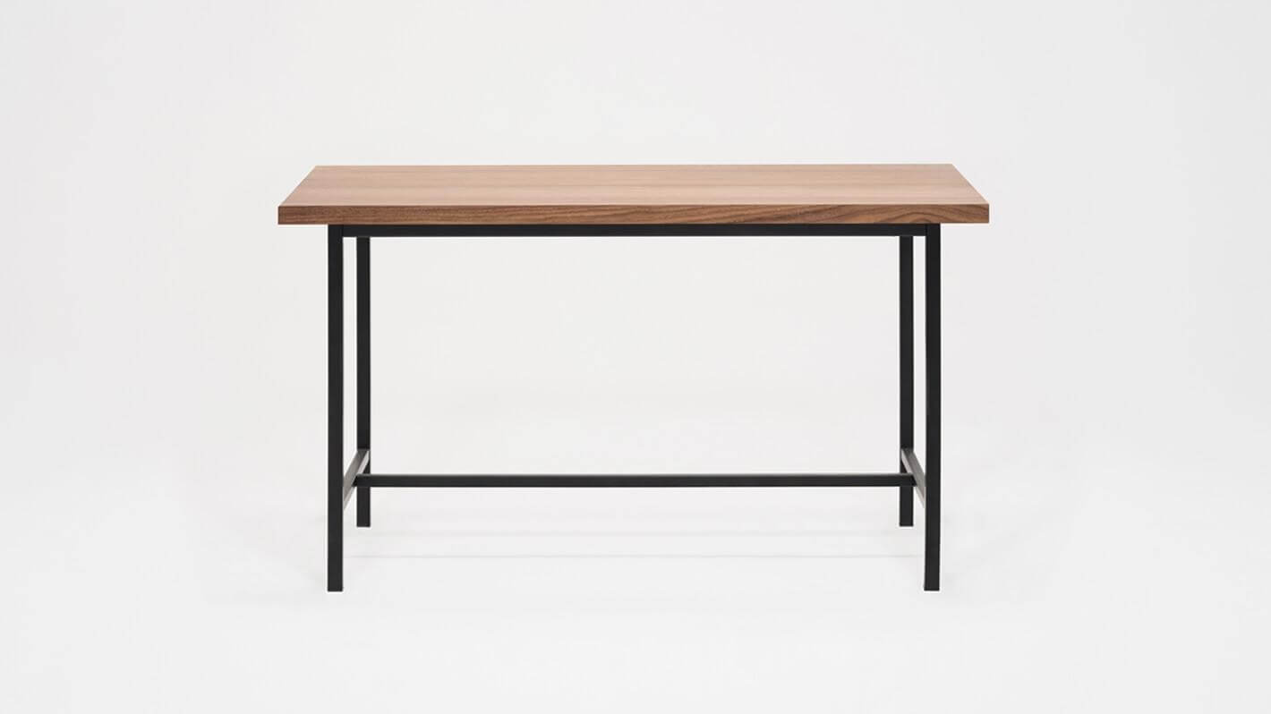 Front view of the Kendall 54" modern dining table with walnut veneer top and black base