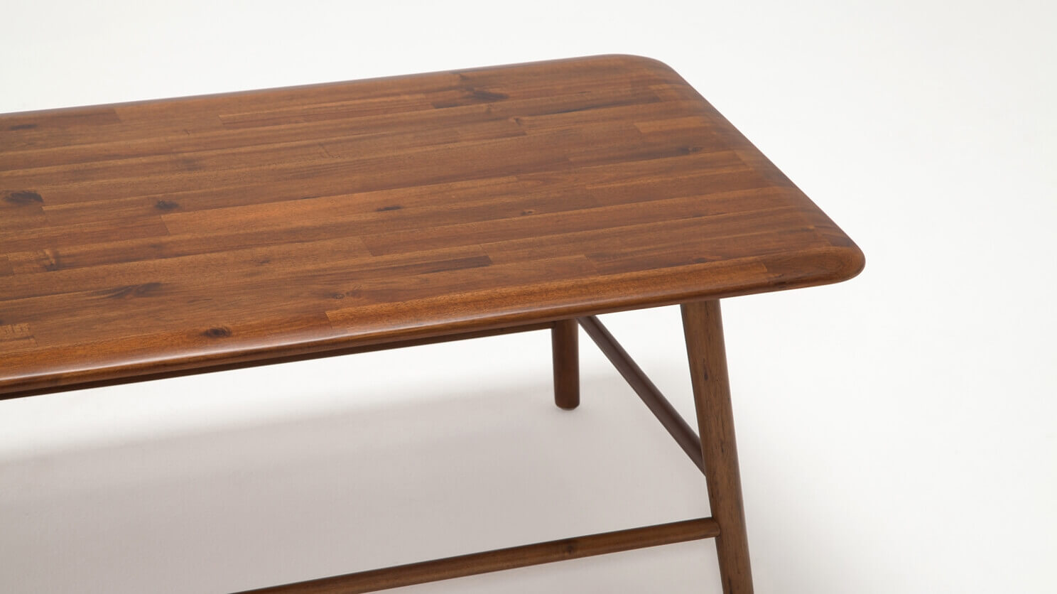 Detail view of the Kacia modern acacia wood coffee table in java