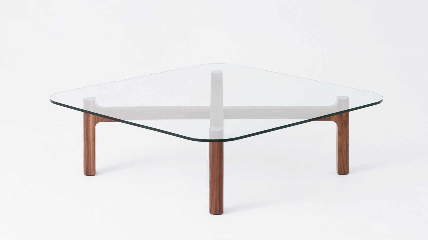 Front view of the Place modern square coffee table with clear glass top and walnut legs