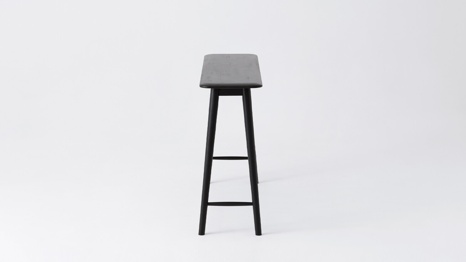 Side view of the Kacia solid wood modern console in black