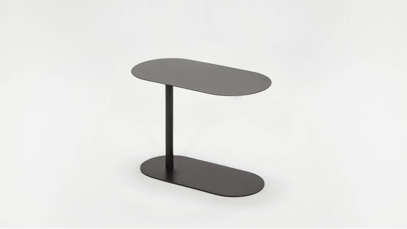 Angled view of the Finn adjustable floating side table in black